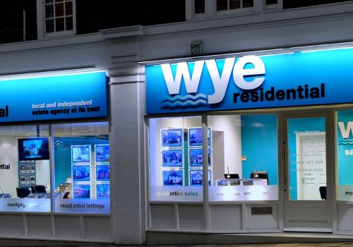 Estate Agent Illuminated Fascia Blue Downlit fascia with window displays and acrylic graphics