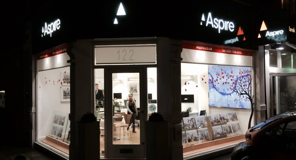 Aspire illuminated shop front with window cling and illuminated interior map