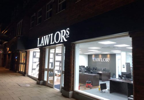 Lawlors shop front illuminated at night just after completion