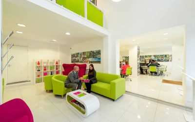 Interior of a office showing posters and green glass all created by first signs.