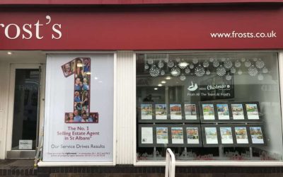 Estate Agent Office Fascia complete with christmas window cling and contravision window graphic.